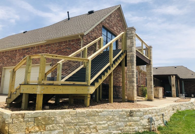 A remodeled outdoor porch on an old brick house adds a modern sophistication as well as additional space for relaxation and recreation.